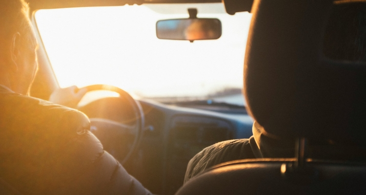 Two people behind the wheel of a car in Illinois