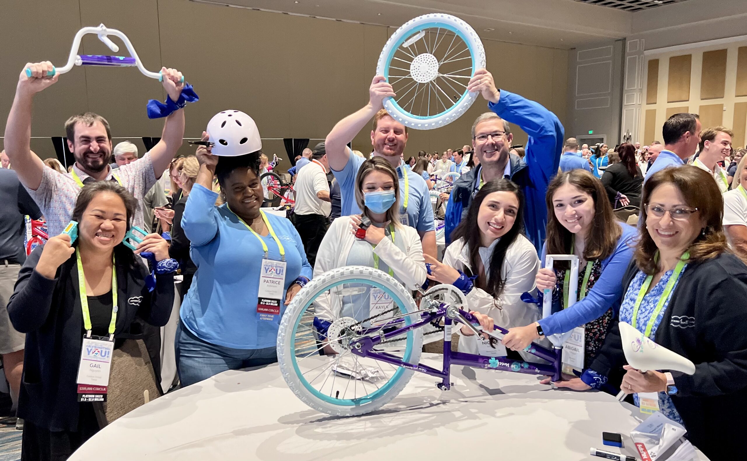 A group of people assembling children's bicycles