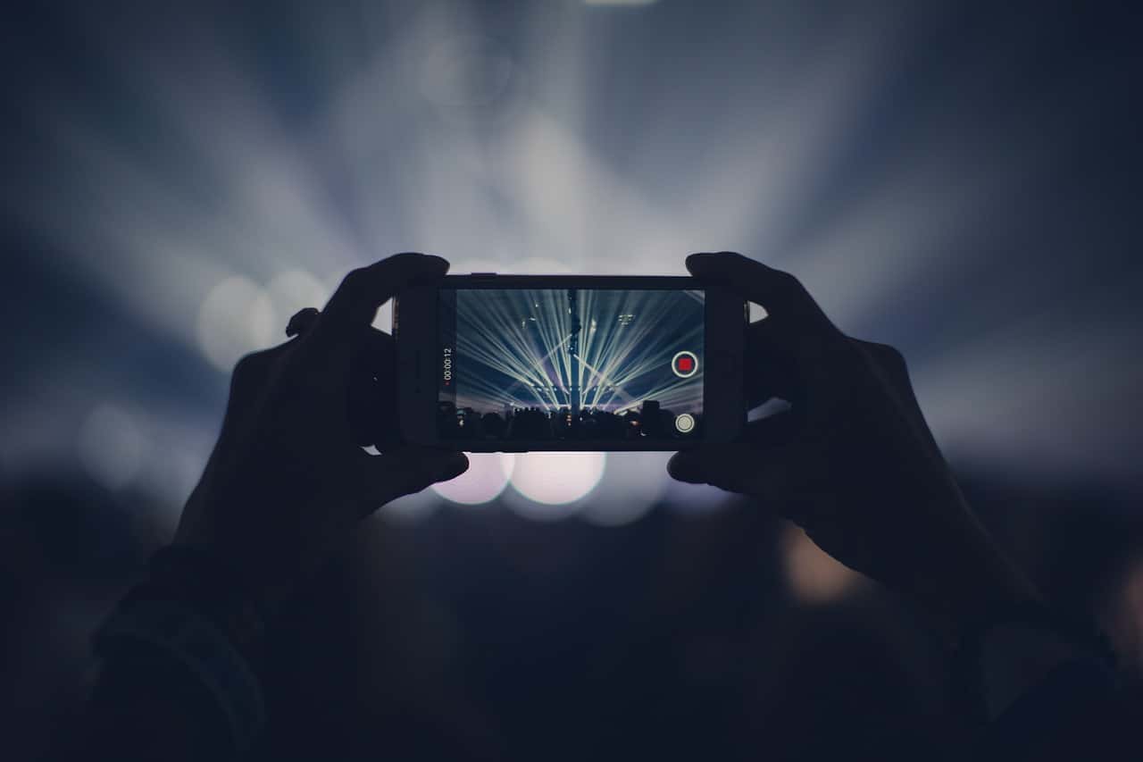 Image by Pexels from Pixabay https://pixabay.com/photos/iphone-concert-lights-stage-lights-1836071/ -- event video marketing