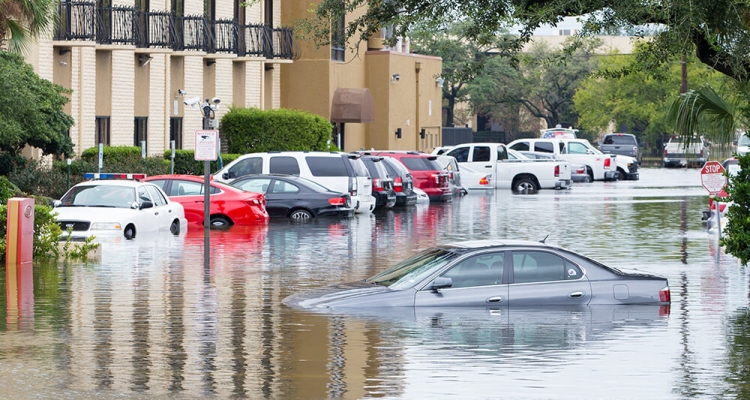 cars half way under water in flood