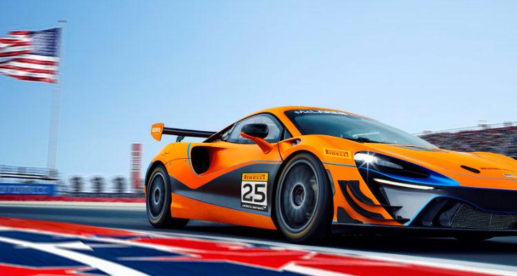 Mclaren Racing Car Speeding Down A Race Track