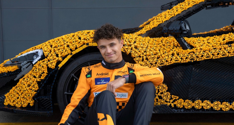 Lando Norris posing in front of the McLaren P1