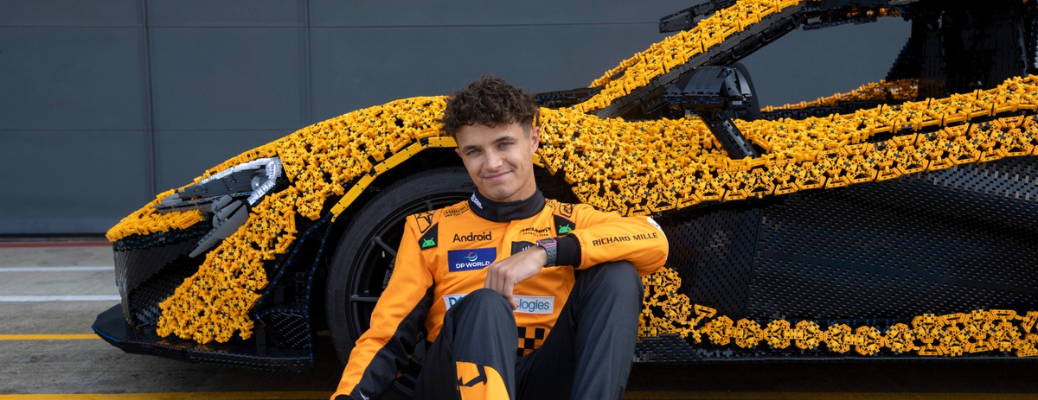 Lando Norris posing in front of the McLaren P1