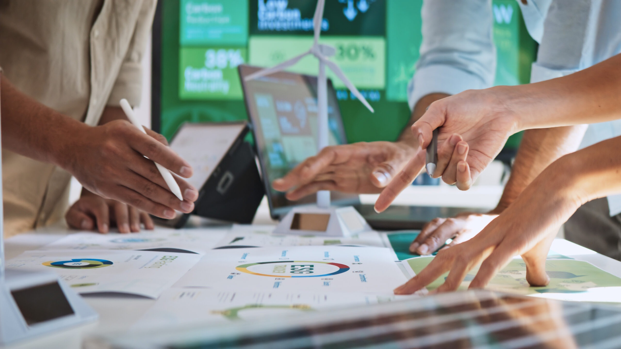 Sustainable Event Planning features an image of a group of business people discussing ESG (Environmental, Social, Governance) organizational planning during a team brainstorming session. Sustainable business, teamwork of colleagues. close up