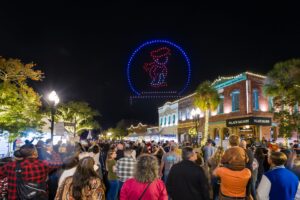 People watch drone show at Dickens Center