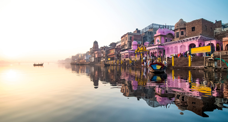 beautiful lakeside buildings reflected in water in India