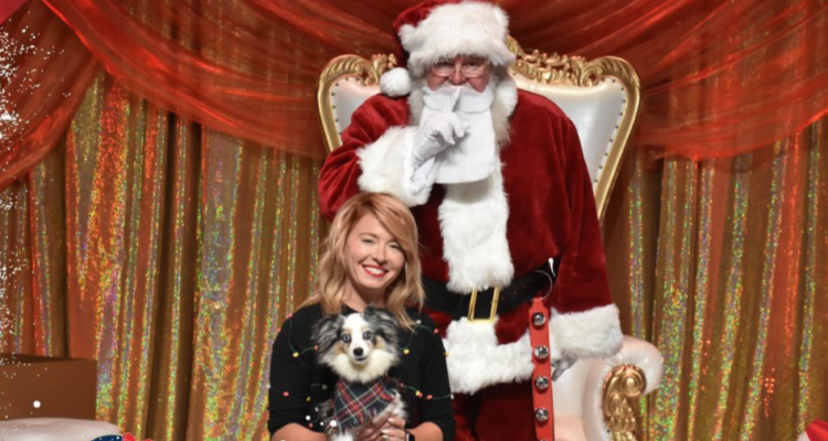 Paw meets Klaus! Puppy posing with Santa Claus at St. Louis Union