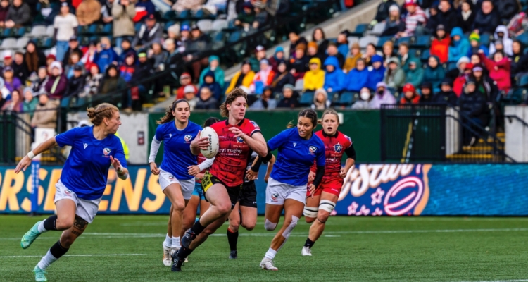 A group playing rugby in a stadium.