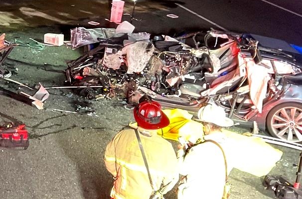 Tesla crashes into parked fire truck, family sues Tesla