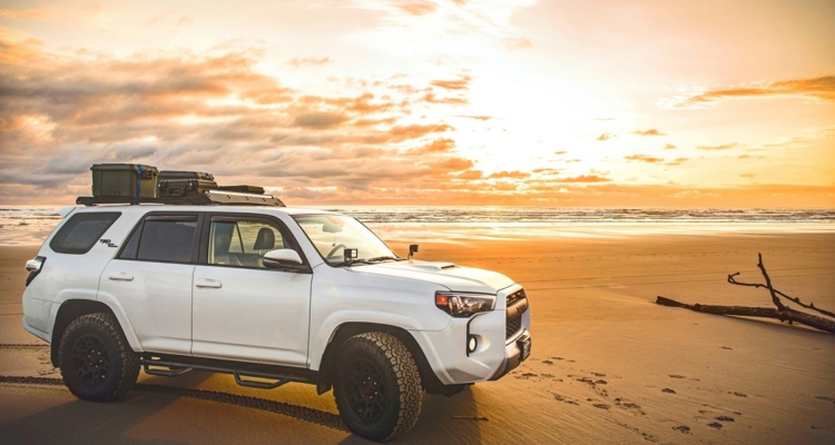 white SUV on beach