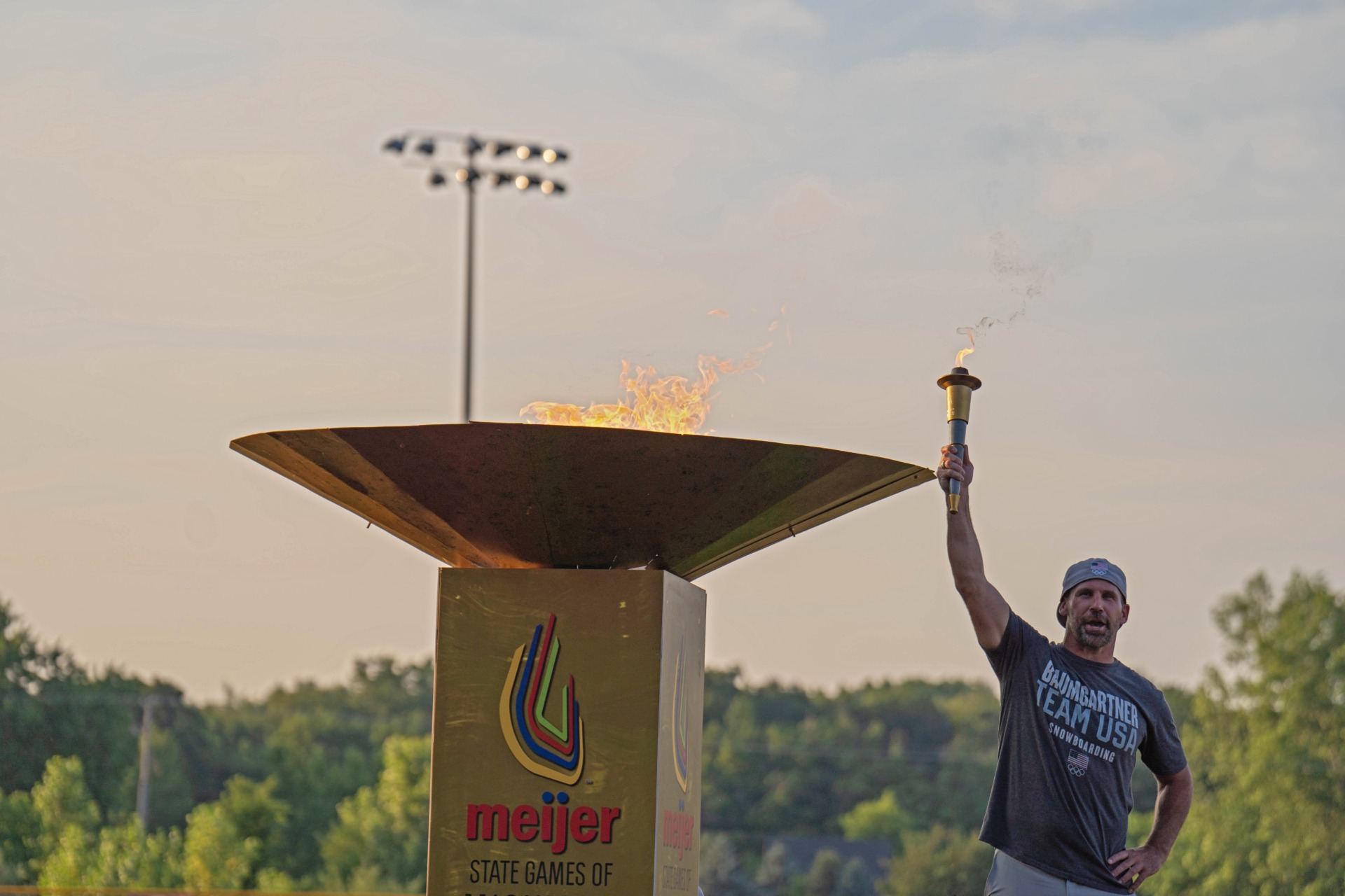 Olympian Nick Baumgartner lights cauldron at 2024 Opening Ceremony